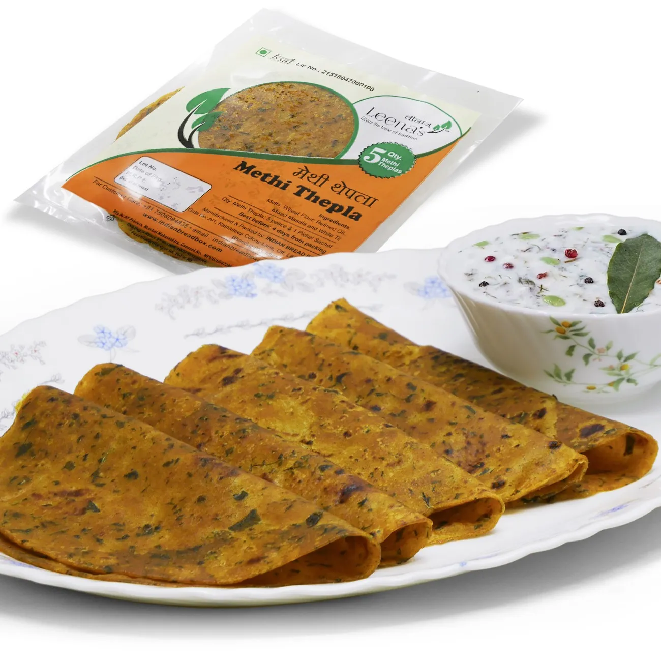 Methi thepla rolls, a savory fenugreek flatbread, served with pickle